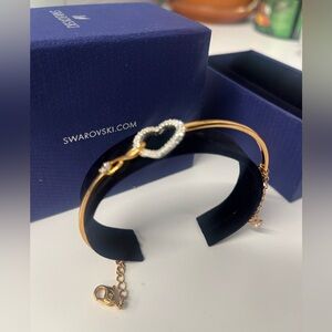 NIB Swarovski Hyperbola bangle, Infinity/heart, metal finish w/ white crystals.